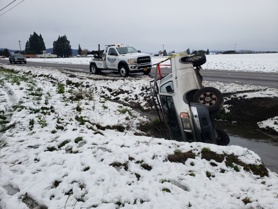 Elite Towing truck at a winter vehicle recovery scene